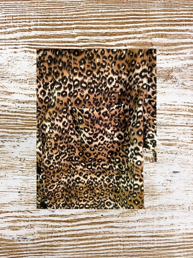This Denim & Co. button down collar shirt features a striking leopard print design