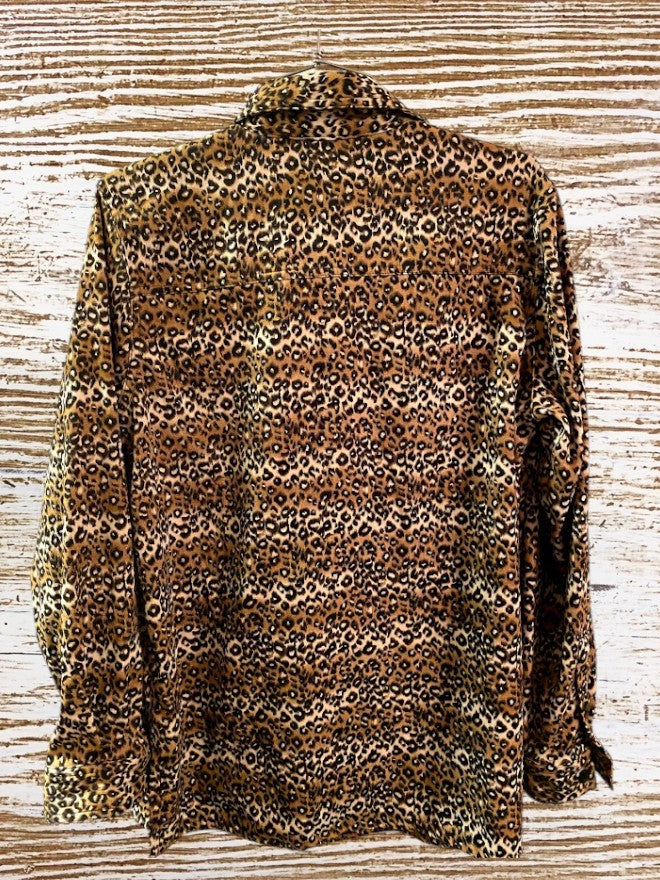 This Denim & Co. button down collar shirt features a striking leopard print design