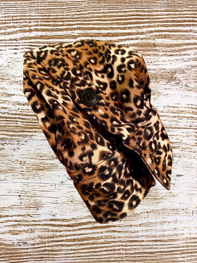 This Denim & Co. button down collar shirt features a striking leopard print design