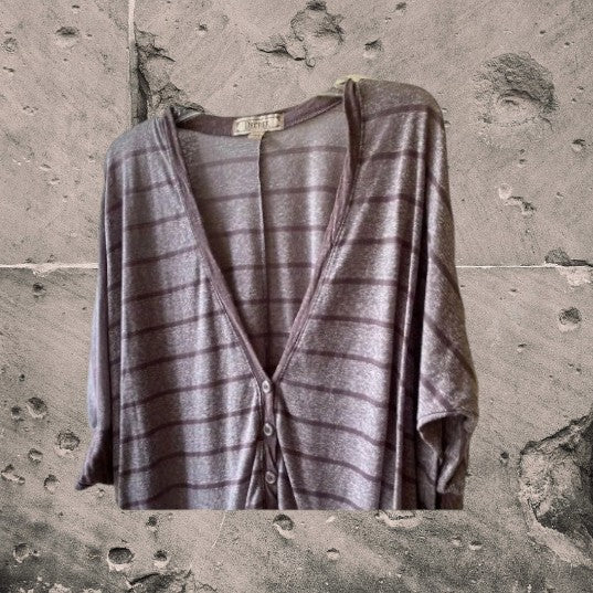 This Decree V-Neck button down top is both comfortable and stylish for any woman