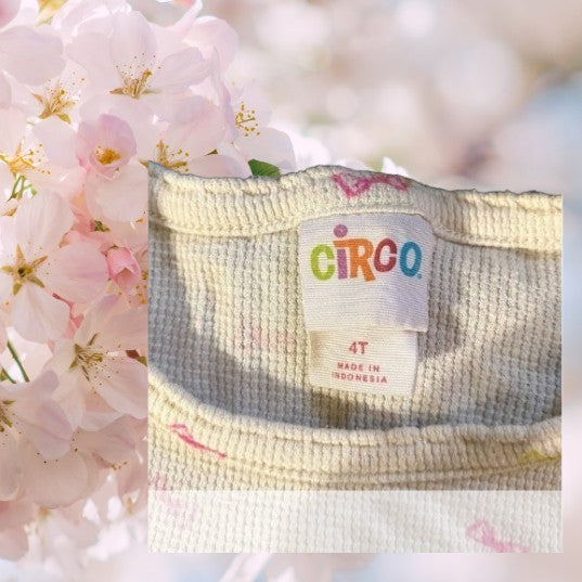 Bring a splash of color to your little one's wardrobe with our Circo vibrant pattern design top