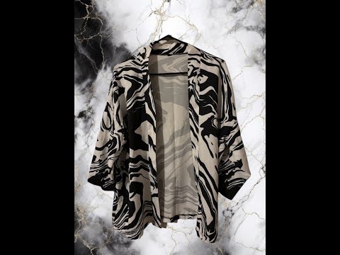 This Kimono cover-up is a stylish and versatile addition to any woman's wardrobe