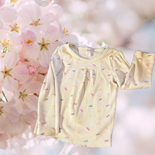 Bring a splash of color to your little one's wardrobe with our Circo vibrant pattern design top