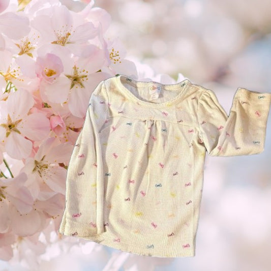Bring a splash of color to your little one's wardrobe with our Circo vibrant pattern design top