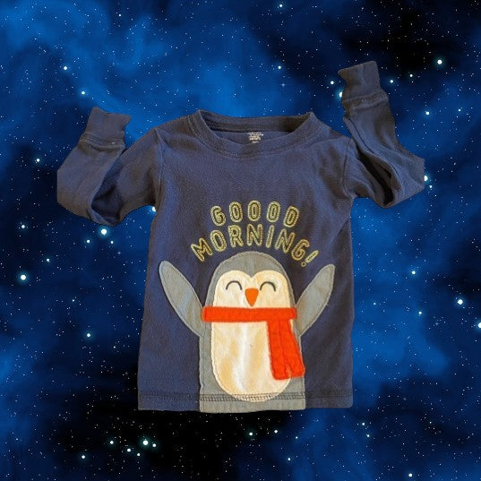 The Carter's Just One You penguin appliqué pajama top, features a playful blue multicolor design