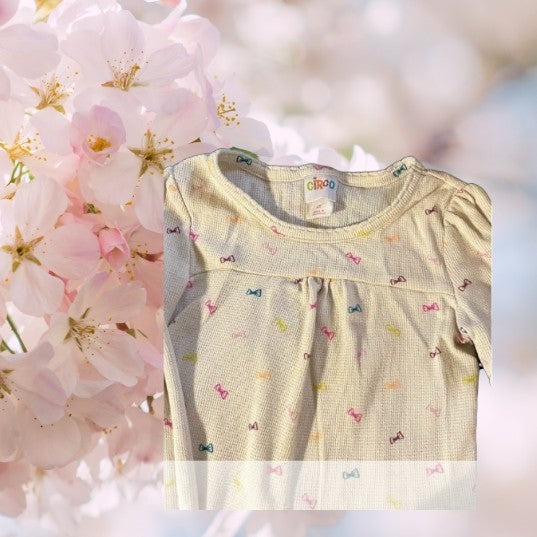 Bring a splash of color to your little one's wardrobe with our Circo vibrant pattern design top