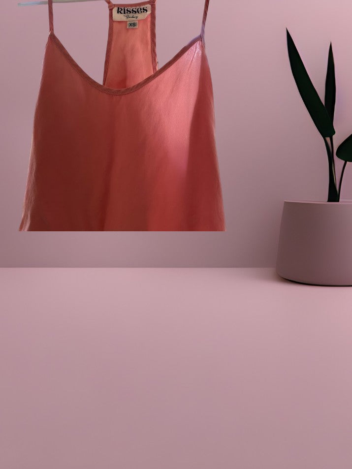 This Kisses silk top is made from 100% silk and offers a luxurious and comfortable fit