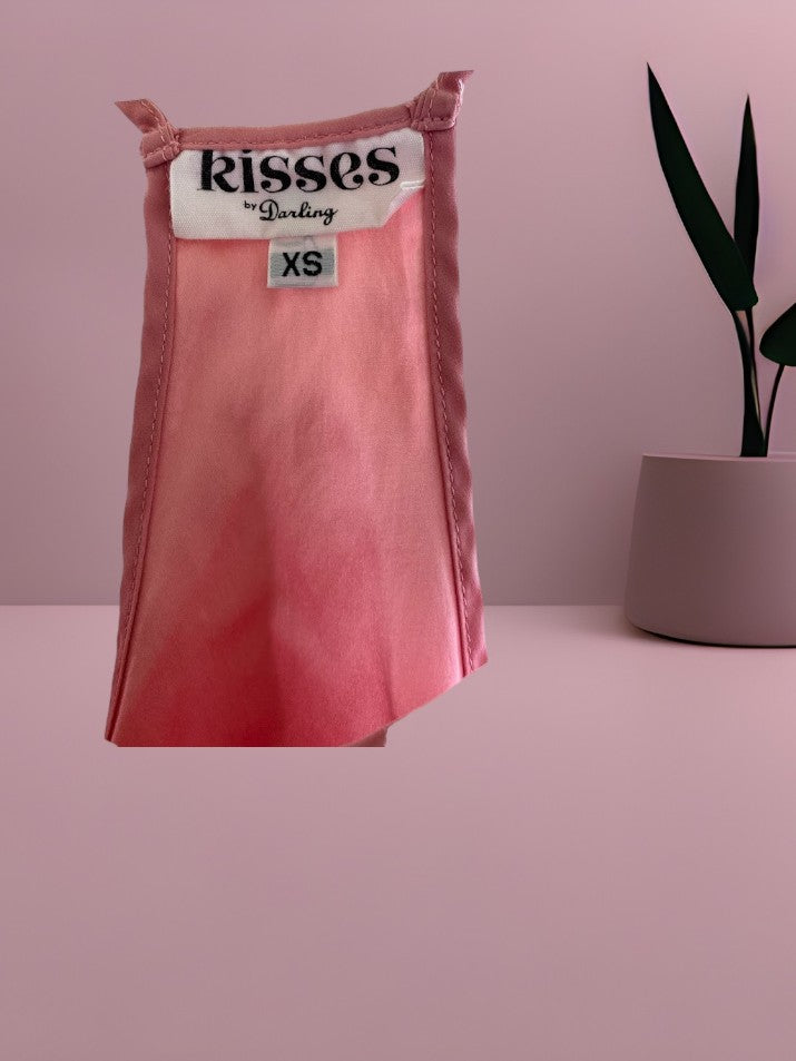 This Kisses silk top is made from 100% silk and offers a luxurious and comfortable fit