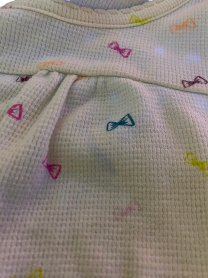 Bring a splash of color to your little one's wardrobe with our Circo vibrant pattern design top