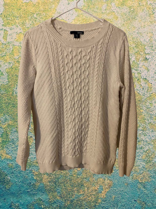 Cable Knit Sweater design features a hi-low hem adding a touch of style and structure