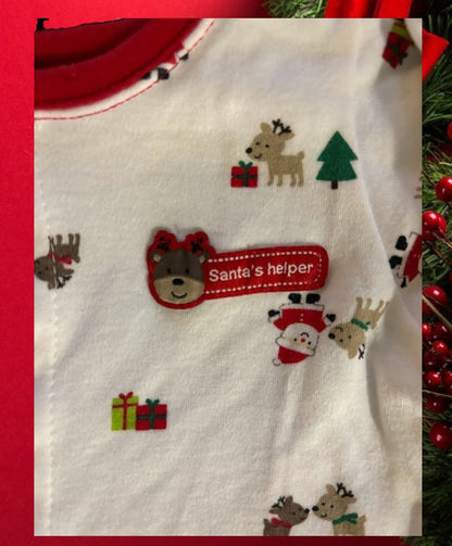 Santa's helper Christmas design adds festive touches to this bodysuit footie