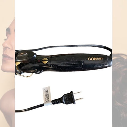 The Conair curling iron features a sturdy stand and protective cover