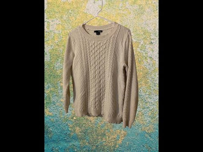 This Basic Editions cable knit sweater design features a hi-low hem adding a touch of style and structure